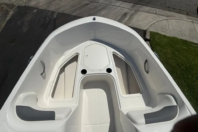 Slide: The Image of 2027 Bayliner Element E16 boat interior with seating and storage compartments. - 20