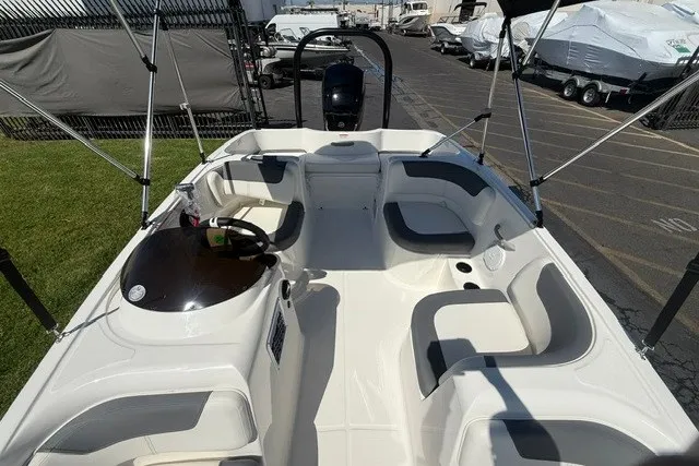 Slide: The Image of 2027 Bayliner Element E16 boat interior with seating and steering console. - 22