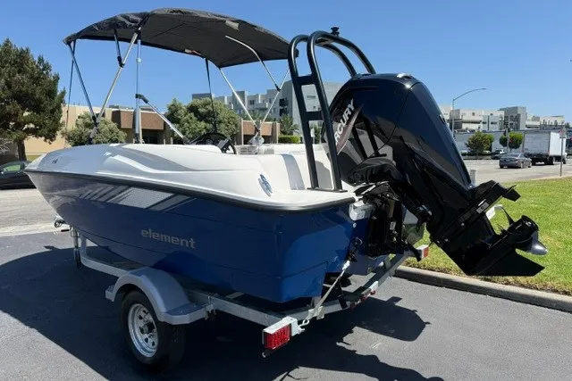 Slide: The Image of 2027 Bayliner Element E16 boat with Mercury outboard motor on a trailer. - 2