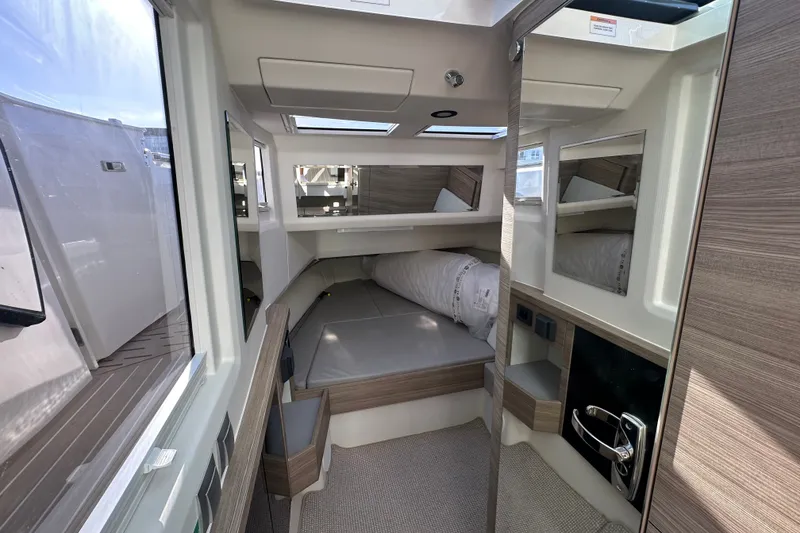 Slide: The Image of Interior cabin of 2027 Saxdor 400 GTC boat, featuring modern design and comfortable sleeping area. - 31