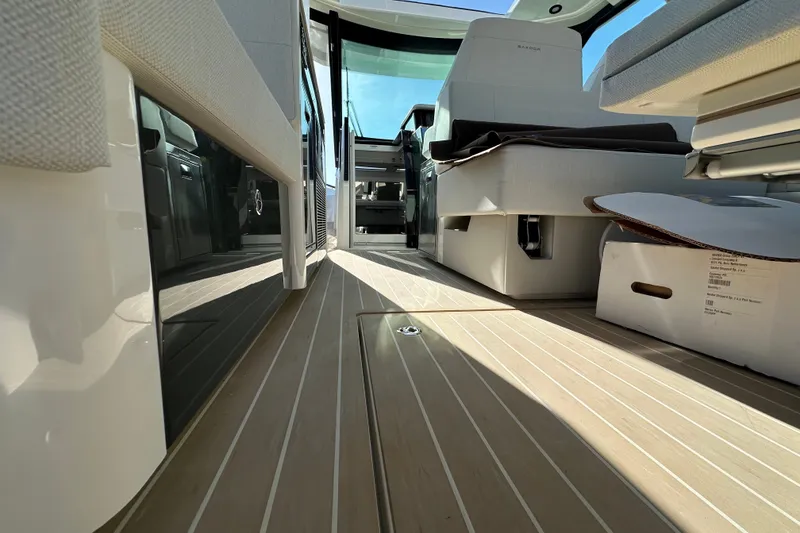 Slide: The Image of Interior view of 2027 Saxdor 400 GTC yacht, showcasing sleek design and modern seating. - 18