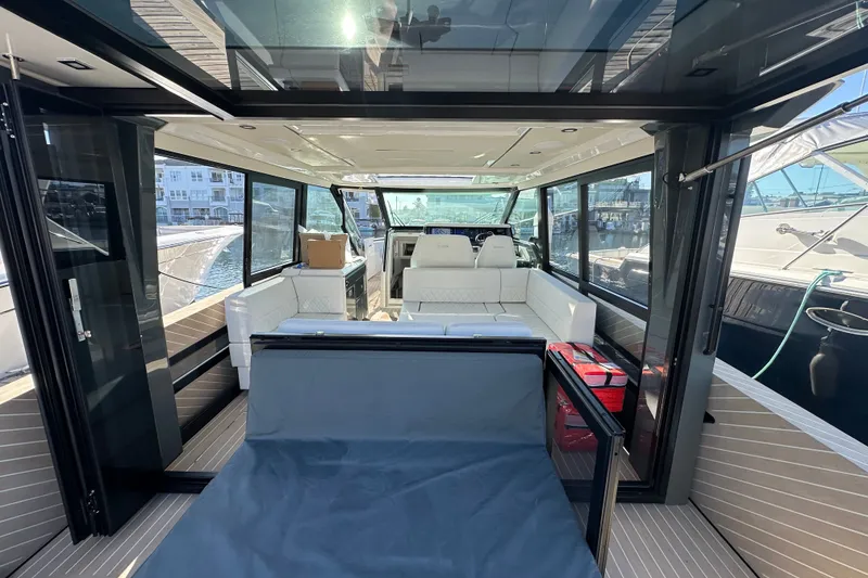 Slide: The Image of Luxurious interior of 2027 Saxdor 400 GTC yacht with modern seating and panoramic windows. - 36
