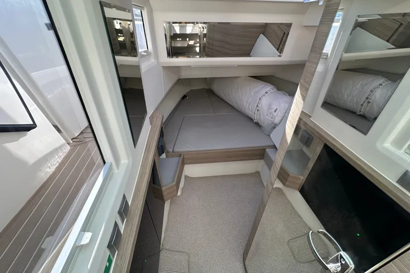 Slide: The Image of Interior of 2027 Saxdor 400 GTC boat, featuring modern design and comfortable sleeping area. - 14