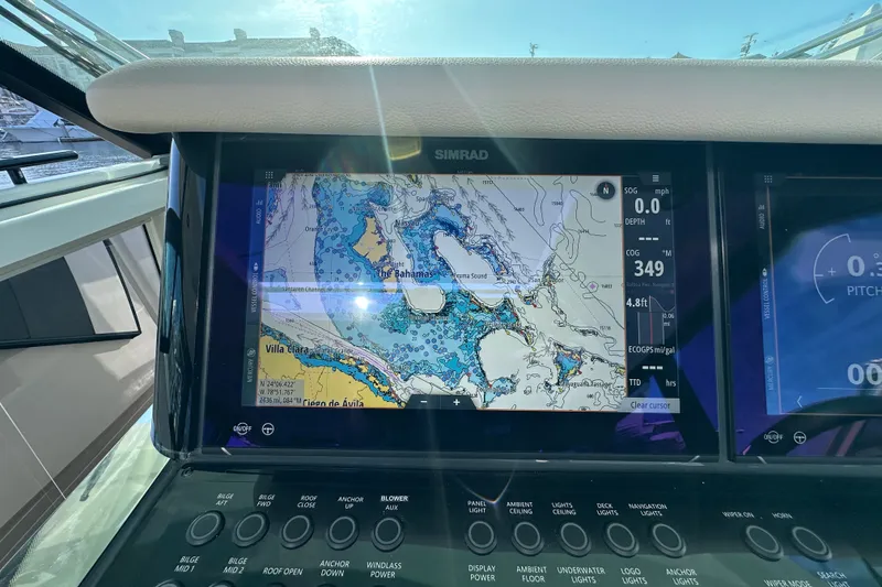Slide: The Image of Simrad navigation display on 2027 Saxdor 400 GTC boat, showing nautical map and controls. - 21