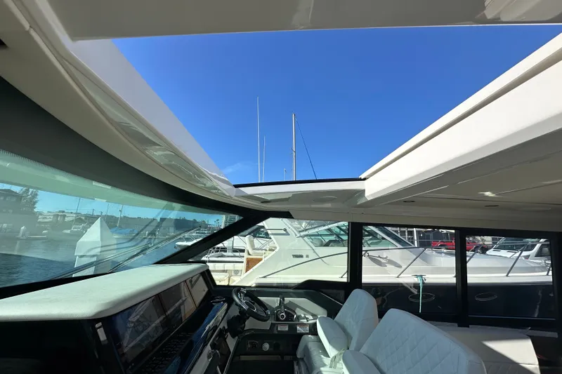 Slide: The Image of Interior view of 2027 Saxdor 400 GTC yacht with modern dashboard and seating. - 16