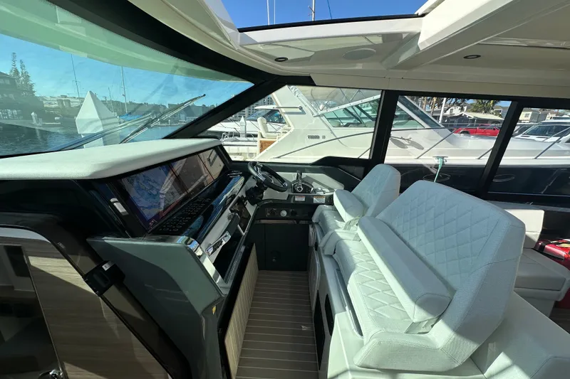 Slide: The Image of Luxurious interior of 2027 Saxdor 400 GTC yacht with modern dashboard and seating. - 15