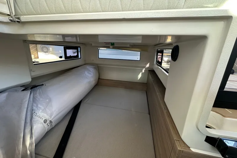Slide: The Image of Interior cabin of 2027 Saxdor 400 GTC boat, featuring modern design and compact sleeping area. - 17