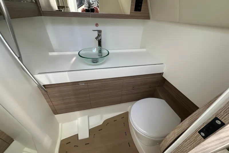 Slide: The Image of Modern bathroom interior of 2027 Saxdor 400 GTC yacht, featuring sleek sink and toilet design. - 28