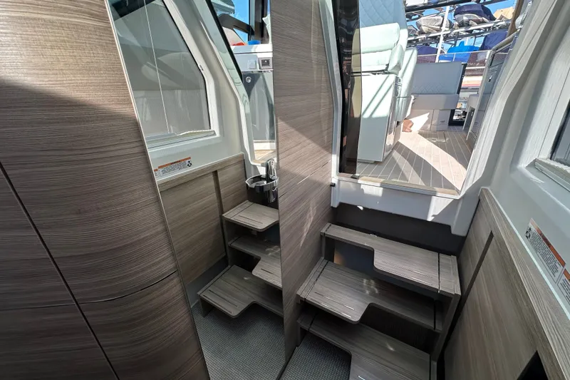 Slide: The Image of Interior of 2027 Saxdor 400 GTC boat with modern wooden steps and sleek design. - 24