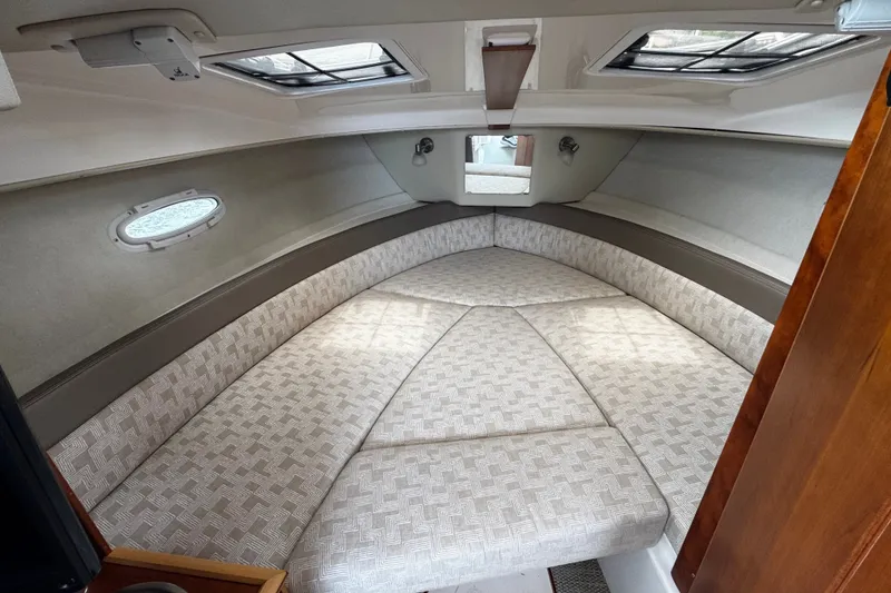 Slide: The Image of 2024 Cutwater C-248 Coupe interior cabin with comfortable V-berth and overhead skylights. - 8
