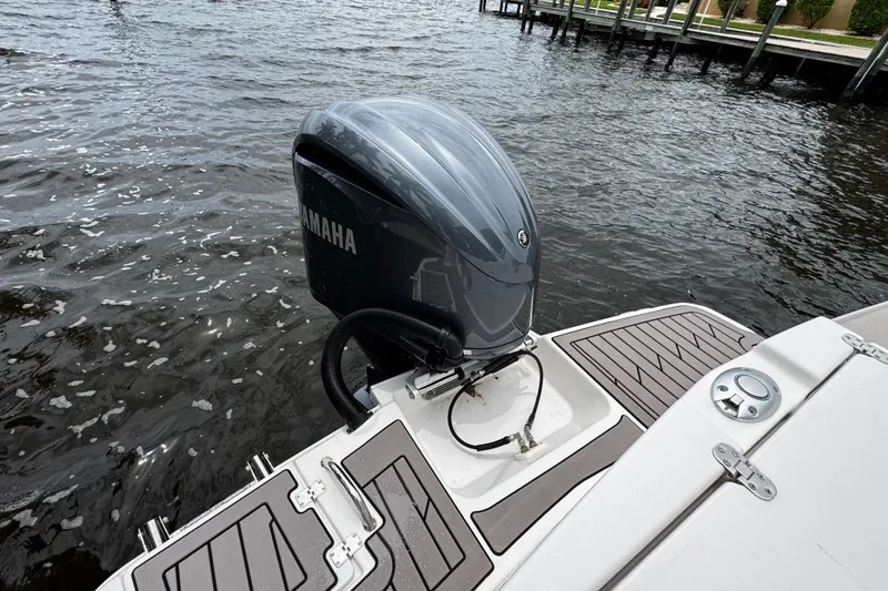 Slide: The Image of 2024 Cutwater C-248 Coupe with Yamaha outboard motor on water. - 2