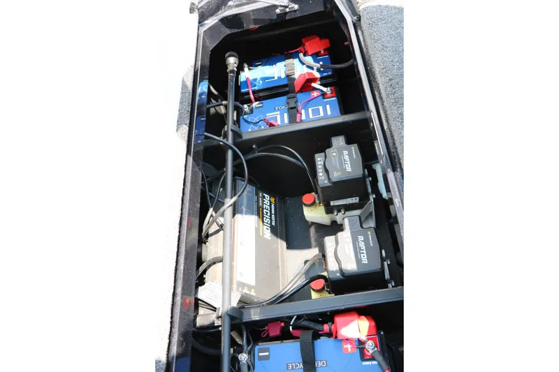 Slide: The Image of 2022 Vexus VX21 boat battery compartment with precision chargers and wiring. - 91