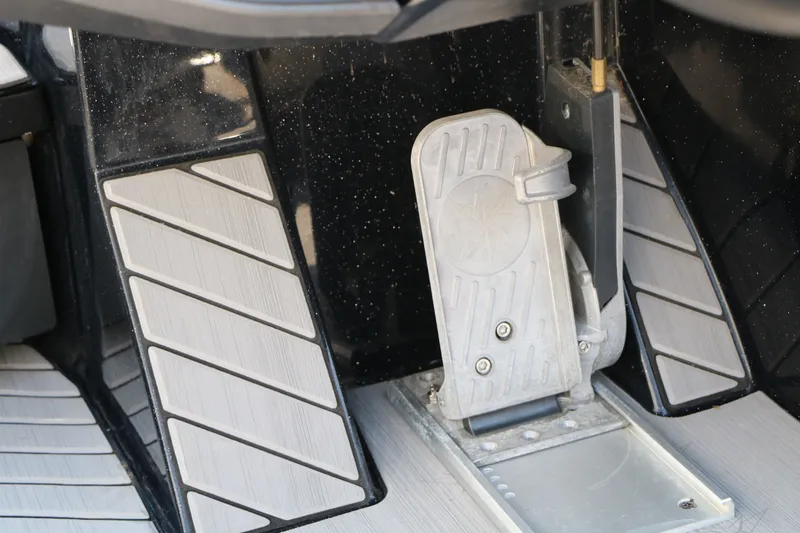 Slide: The Image of Foot pedal of a 2022 Vexus VX21 boat, featuring sleek design and textured flooring. - 68