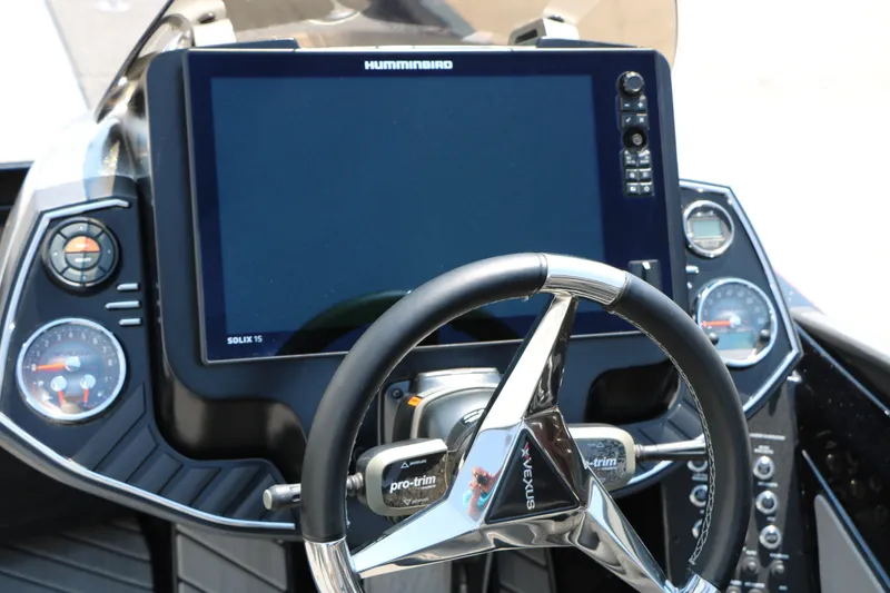 Slide: The Image of 2022 Vexus VX21 boat dashboard with steering wheel and Humminbird Solix 15 display. - 85