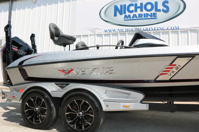 Slide: The Image of 2022 Vexus VX21 boat at Nichols Marine dealership, showcasing sleek design and modern features. - 7