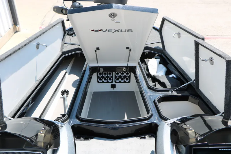 Slide: The Image of 2022 Vexus VX21 boat interior storage compartments open, showcasing organized space. - 51