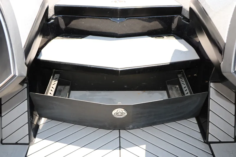 Slide: The Image of 2022 Vexus VX21 boat storage compartment with sleek black design and modern features. - 95