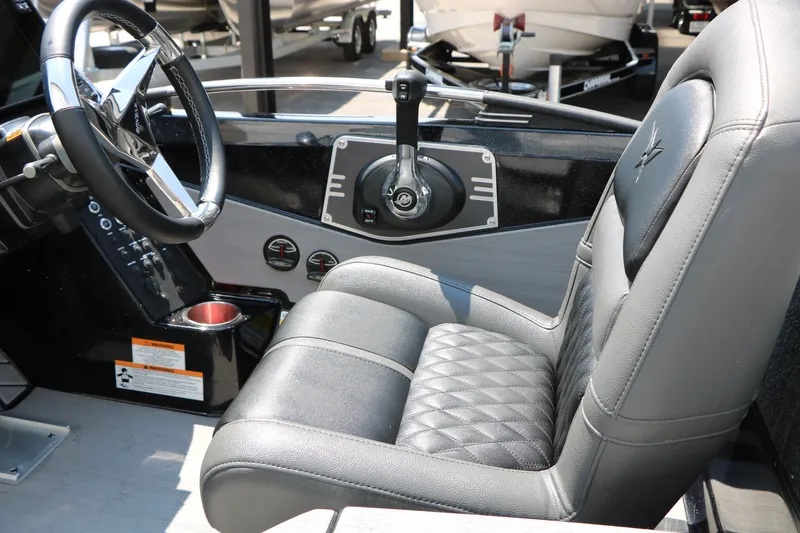 Slide: The Image of 2022 Vexus VX21 boat interior with steering wheel and luxurious seating. - 82