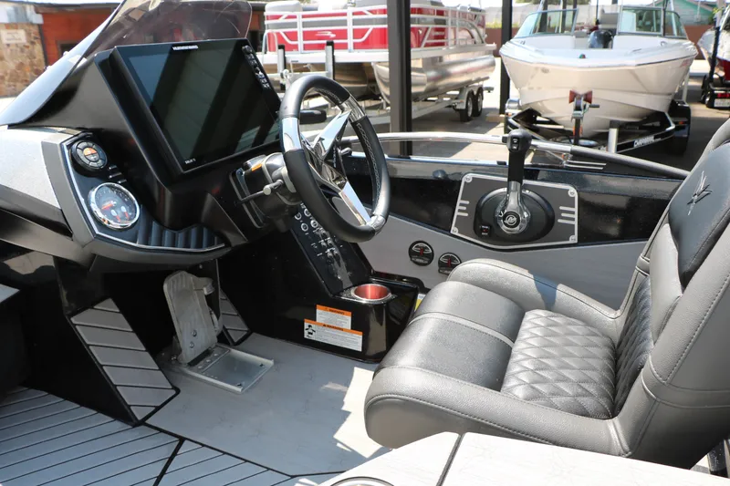 Slide: The Image of Interior of a 2022 Vexus VX21 boat featuring a modern steering console and luxurious seating. - 81