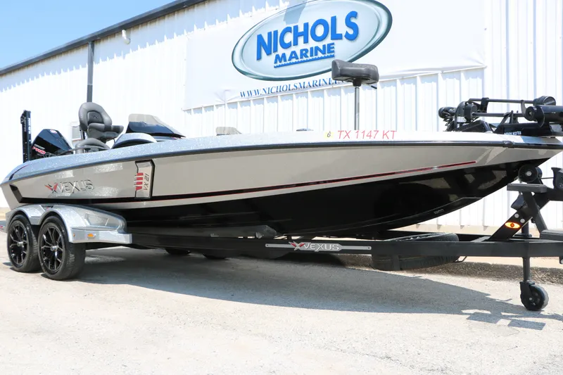 Slide: The Image of 2022 Vexus VX21 boat on trailer at Nichols Marine dealership. - 2