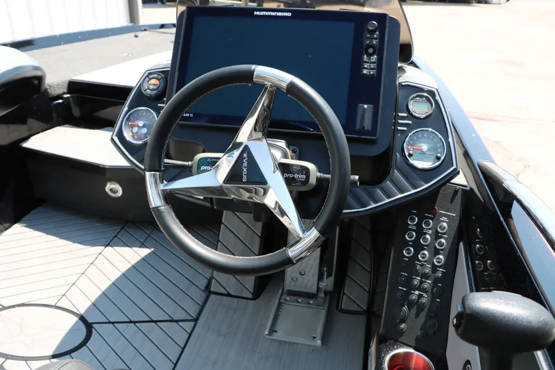 Slide: The Image of 2022 Vexus VX21 boat dashboard with steering wheel and electronic display. - 67