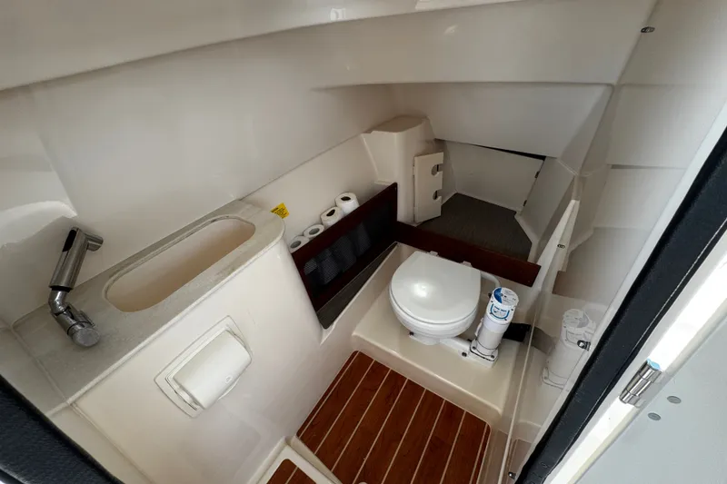 Slide: The Image of 2022 Grady-White Freedom 285 boat bathroom with sink, toilet, and wooden flooring. - 47