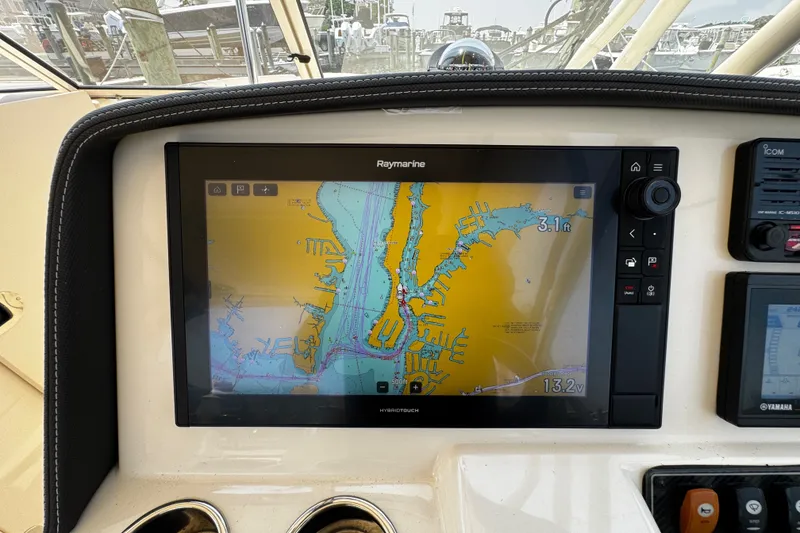 Slide: The Image of Dashboard of 2022 Grady-White Freedom 285 with Raymarine navigation display. - 29