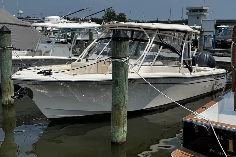 The Image of 2022 Grady-White Freedom 285 boat docked at marina, featuring sleek design and modern amenities. - 0