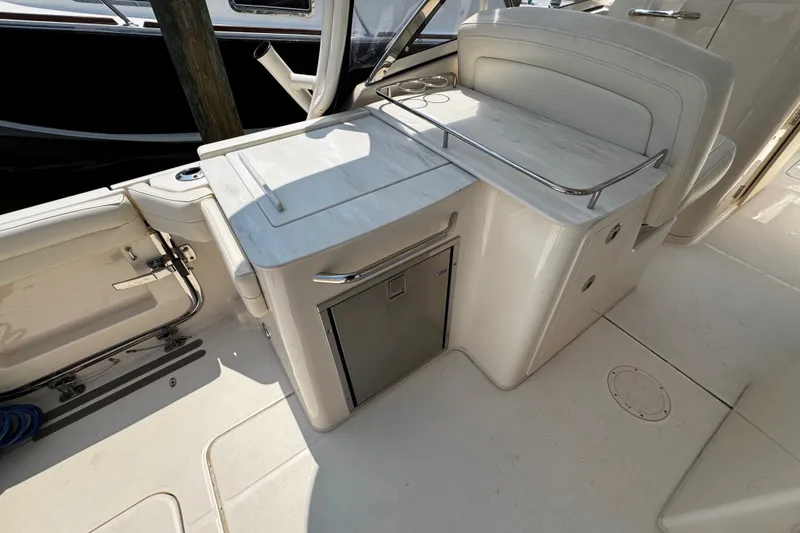 Slide: The Image of 2022 Grady-White Freedom 285 boat interior with seating and storage area. - 44