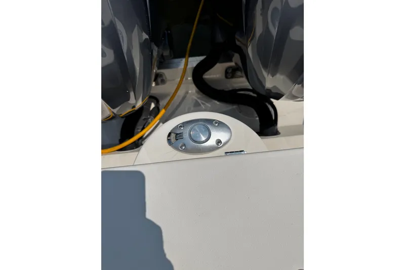 Slide: The Image of Close-up of 2022 Grady-White Freedom 285 boat engine area with cables and fittings. - 48
