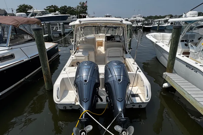 Slide: The Image of 2022 Grady-White Freedom 285 boat docked with twin Yamaha 300 V6 engines. - 3