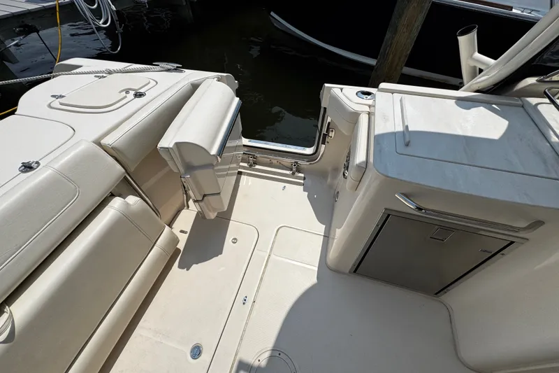 Slide: The Image of 2022 Grady-White Freedom 285 boat interior with seating and storage compartments. - 43