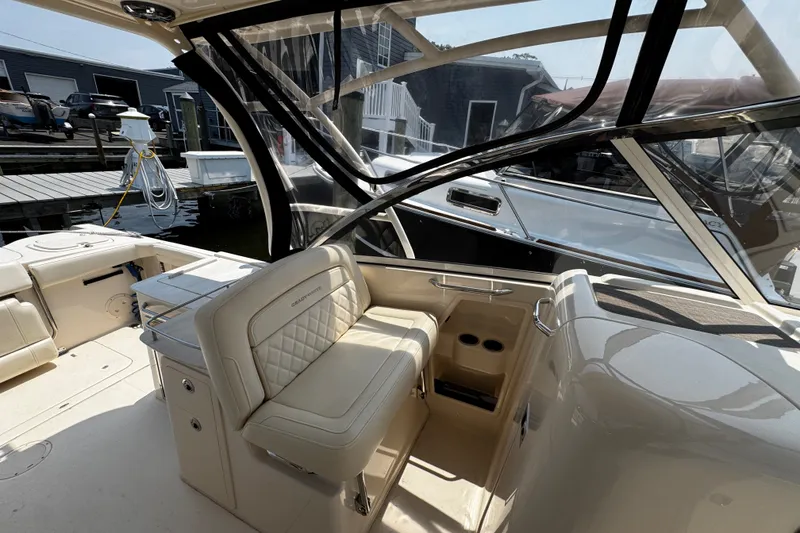 Slide: The Image of 2022 Grady-White Freedom 285 boat interior with luxurious seating and modern design. - 20