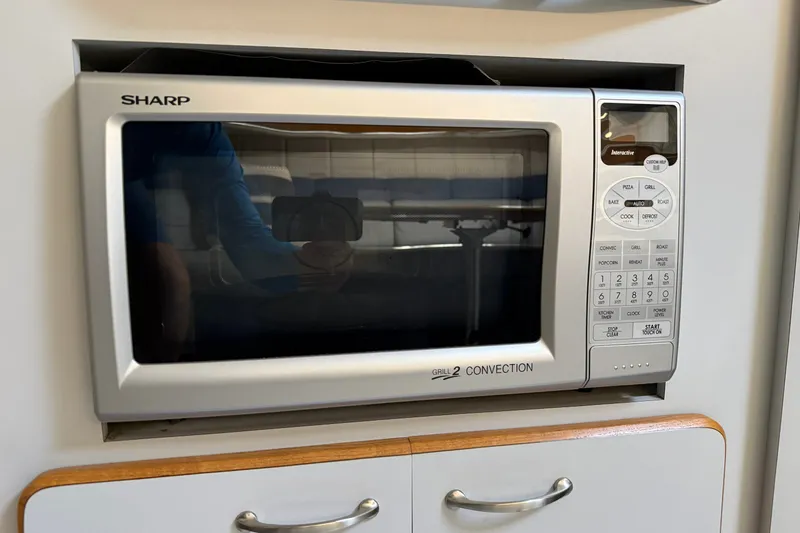 Slide: The Image of Sharp convection microwave in a 1990 Sea Ray 420 Sundancer yacht kitchen. - 17
