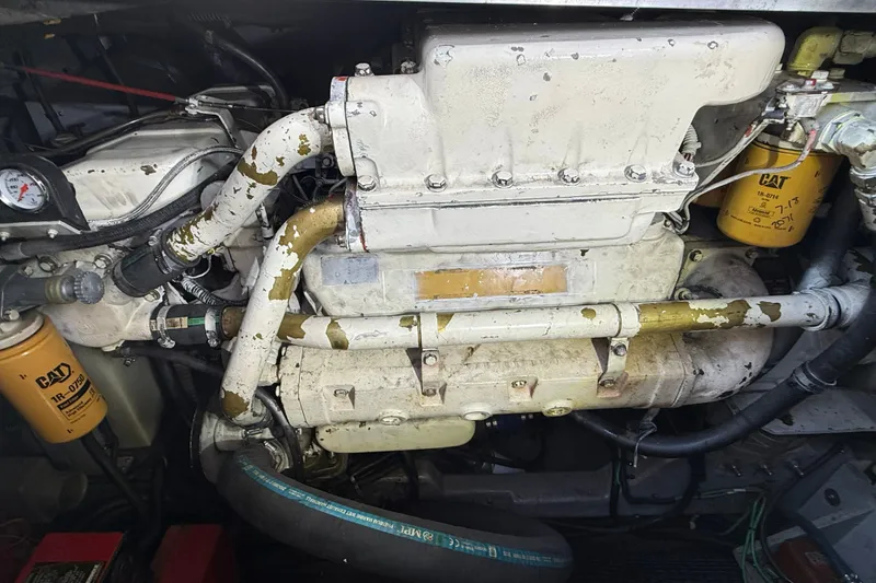 Slide: The Image of Engine compartment of a 1990 Sea Ray 420 Sundancer with visible CAT filters. - 28
