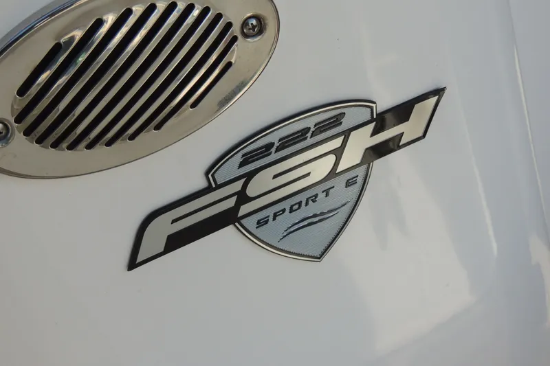 Slide: The Image of 2023 Yamaha Boats 222 FSH Sport E emblem on white surface. - 16
