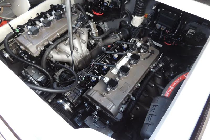 Slide: The Image of Engine compartment of 2023 Yamaha Boats 222 FSH Sport E, showcasing intricate mechanical components. - 15