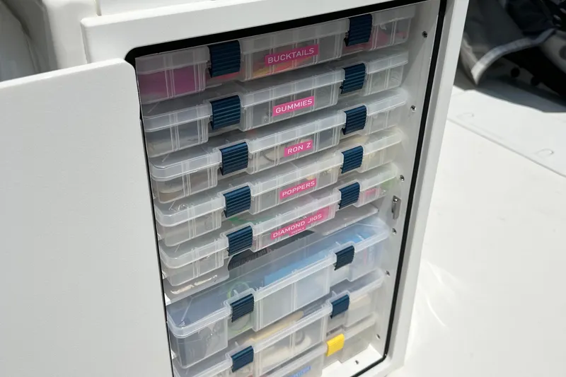 Slide: The Image of Tackle storage on 2024 Parker 2300 Special Edition boat, featuring organized fishing gear compartments. - 14