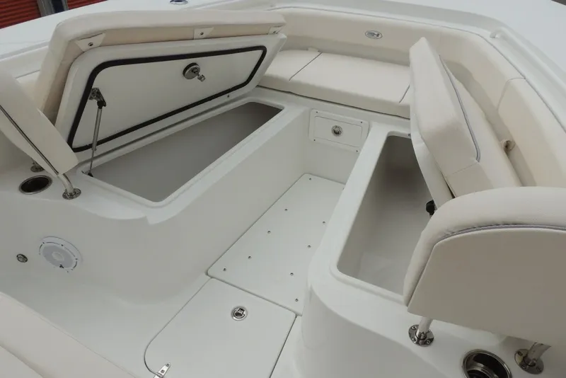 Slide: The Image of 2025 Sea Hunt Gamefish 28 boat interior with open storage compartments and seating. - 27