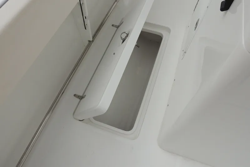Slide: The Image of Open storage compartment on 2025 Sea Hunt Gamefish 28 boat deck. - 23