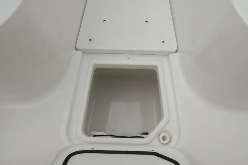Slide: The Image of Storage compartment on a 2025 Sea Hunt Gamefish 28 boat, featuring a clean white interior. - 29