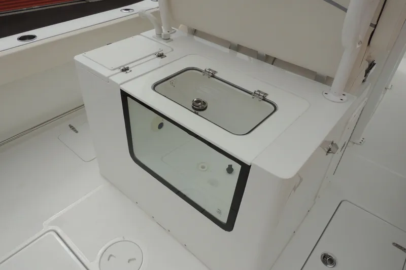Slide: The Image of 2025 Sea Hunt Gamefish 28 boat interior with livewell and storage compartments. - 20