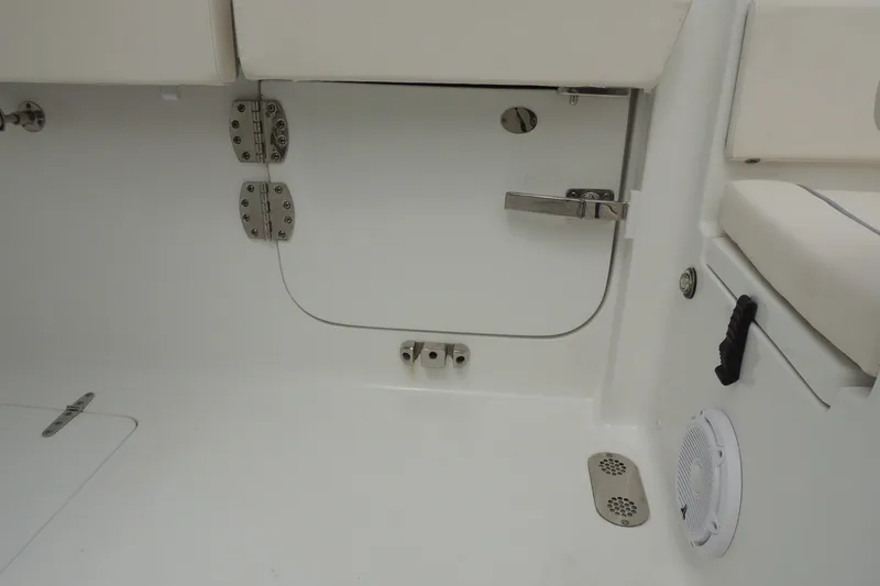Slide: The Image of Interior view of 2025 Sea Hunt Gamefish 28 boat, featuring storage compartment and seating. - 24