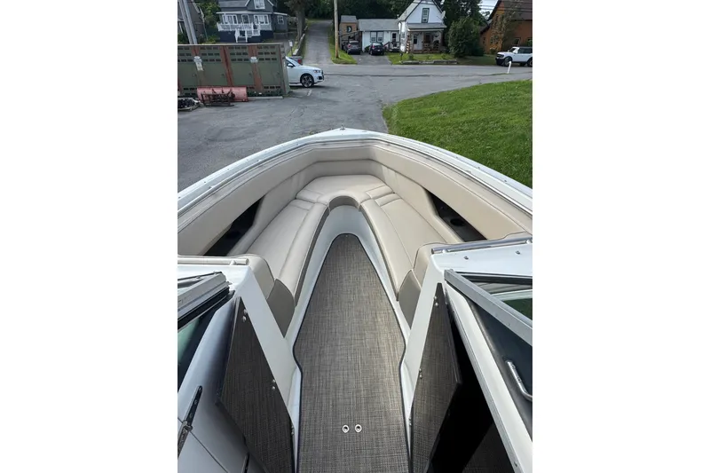 Slide: The Image of Interior view of a 1996 Cobalt 272 boat with beige seating and open bow area. - 42