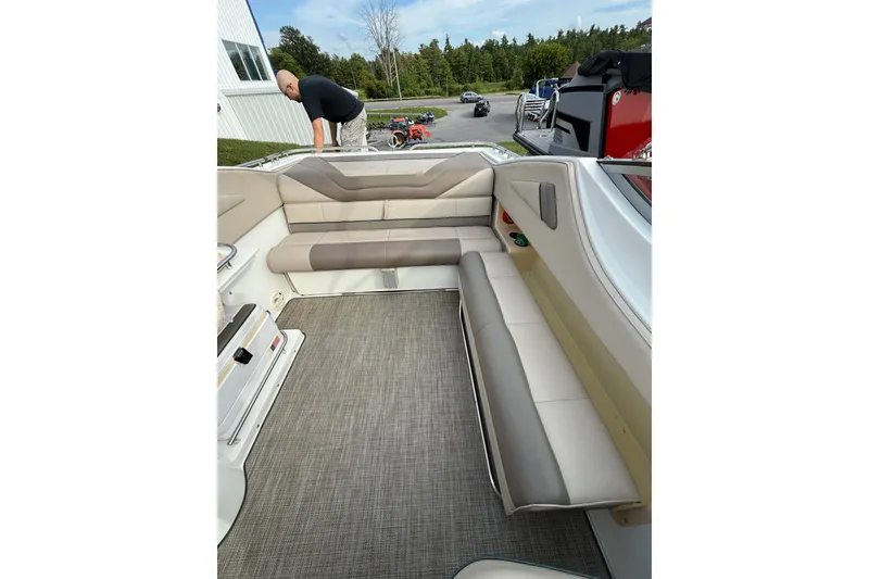 Slide: The Image of Interior of a 1996 Cobalt 272 boat with beige seating and carpeted floor. - 22
