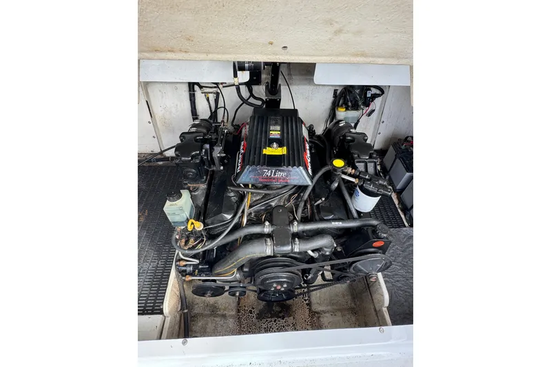 Slide: The Image of Engine compartment of a 1996 Cobalt 272 boat, featuring a 7.4L engine. - 51