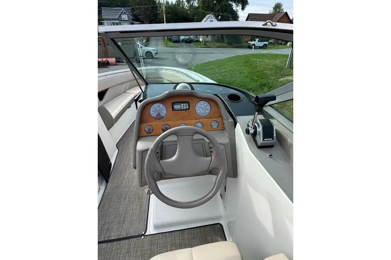 Slide: The Image of Interior view of a 1996 Cobalt 272 boat cockpit with steering wheel and dashboard. - 43