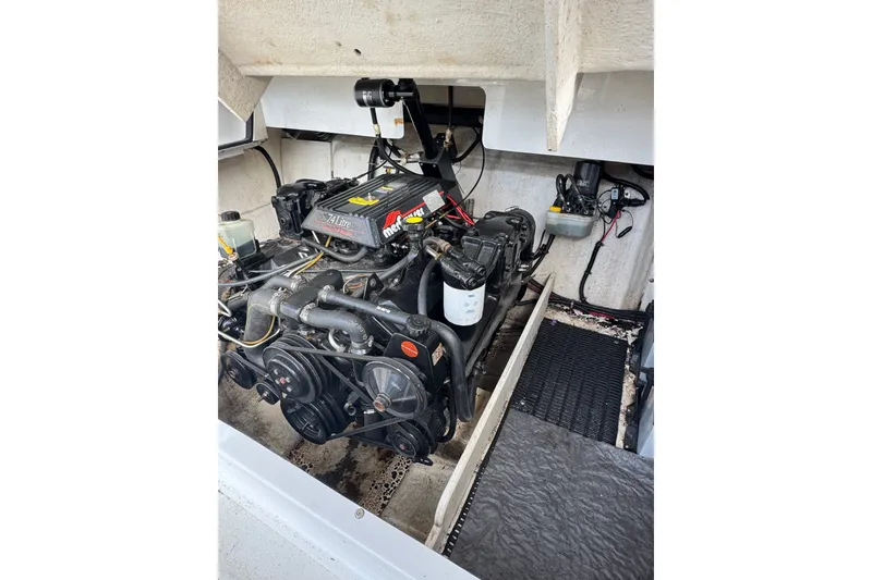 Slide: The Image of Engine compartment of a 1996 Cobalt 272 boat, featuring a MerCruiser 7.4L engine. - 25
