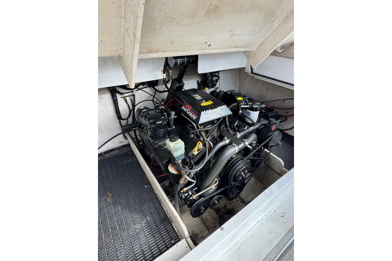 Slide: The Image of Engine compartment of a 1996 Cobalt 272 boat, featuring a MerCruiser engine. - 24