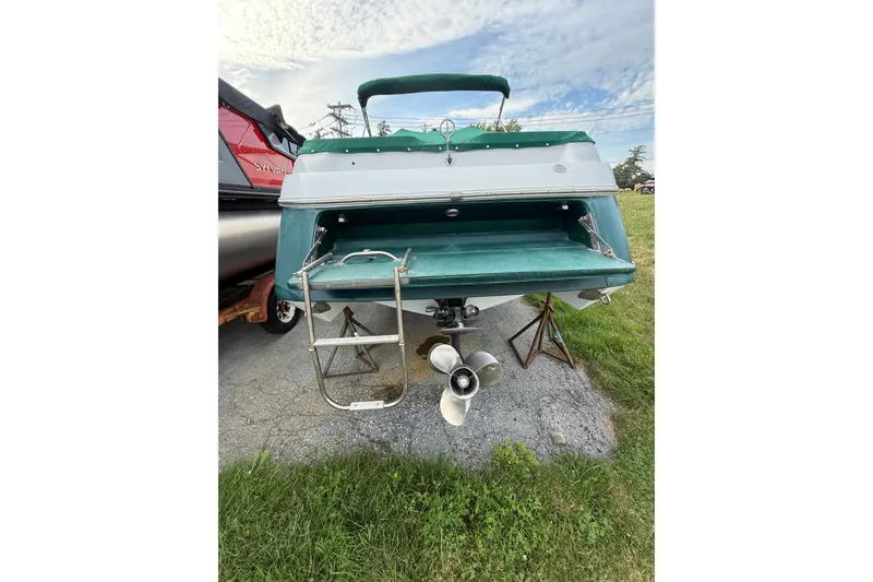 Slide: The Image of Rear view of a 1996 Cobalt 272 boat with ladder and propeller. - 35